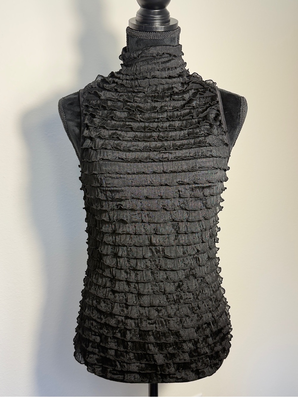 Sleeveless Black Blouse With Horizontal Tiered Ruffling & High Mock Neck